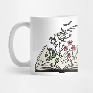 flowers growing from the book Mug